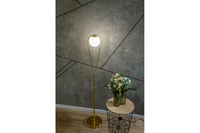 Decor Ciklop medeninasta zlata talna svetilka z videzom kapljice 9737